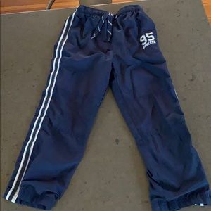 Boys Oshkosh navy lined track pants.